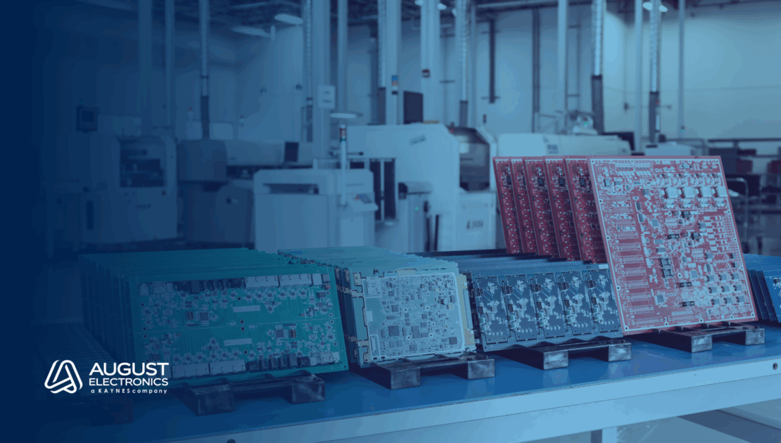 Multiple colored printed circuit boards (PCBs) organized on a workstation inside August Electronics' advanced manufacturing facility, highlighting high-mix, low-to-medium volume electronics production capabilities.