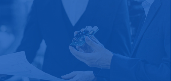 A blue-toned image of two people in business attire, with one holding a small object out to the other, suggesting a handoff or transaction.