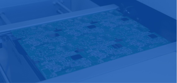 Populated circuit board moving along a conveyor inside an SMT assembly line, shown in a blue tint.