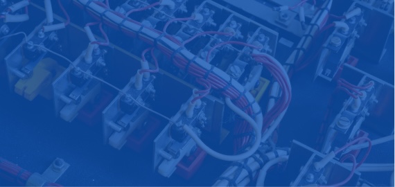 Rows of terminal blocks with bundled red and white wiring in an electrical control panel.