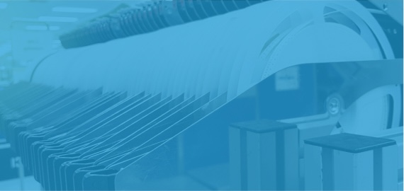 Rows of component feeder reels on a surface mount pick-and-place machine.